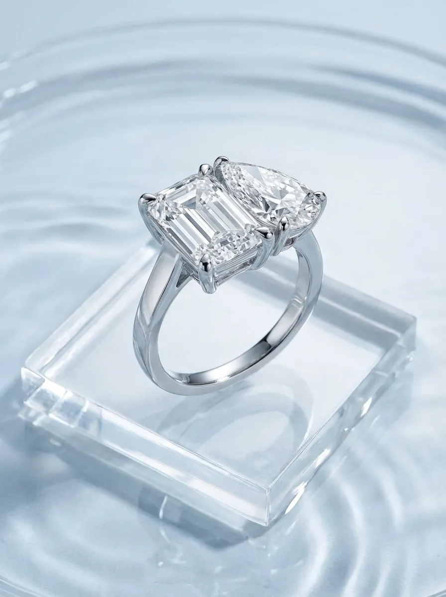 Lab-grown diamond ring on reflective water surface